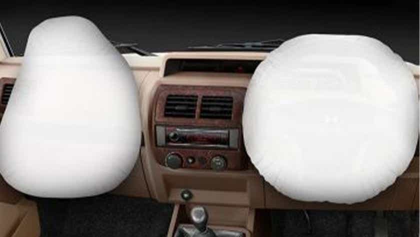 Front dashboard view of a Mahindra Bolero with deployed airbags