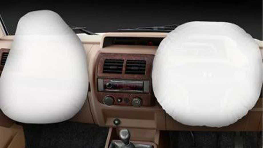 Front dashboard view of a Mahindra Bolero with deployed airbags