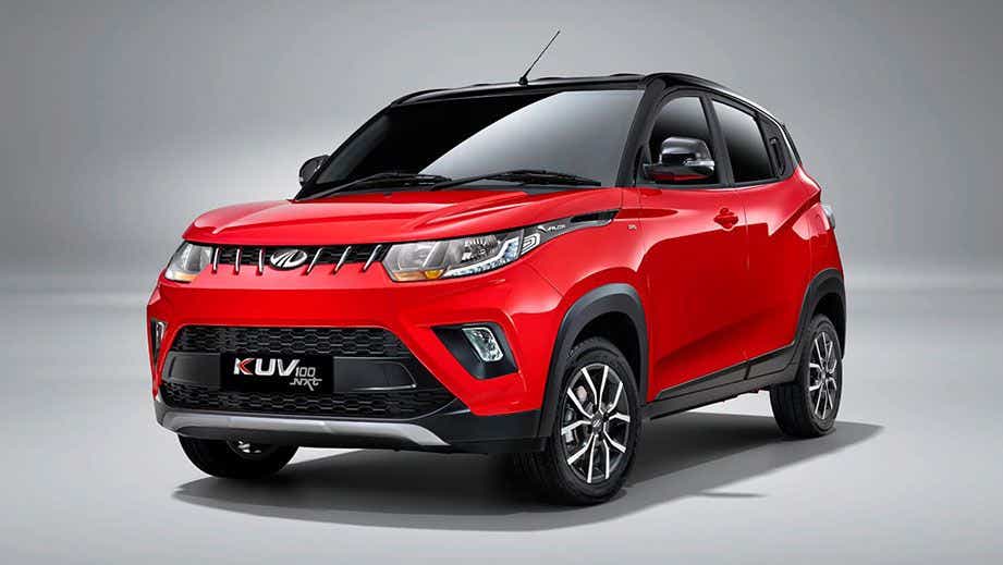 front three-quarter view of a Flamboyant Red Mahindra KUV 100 NXT