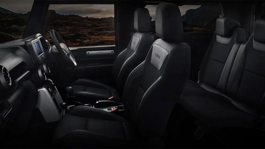 Interior dashboard and front seats of a Mahindra Thar