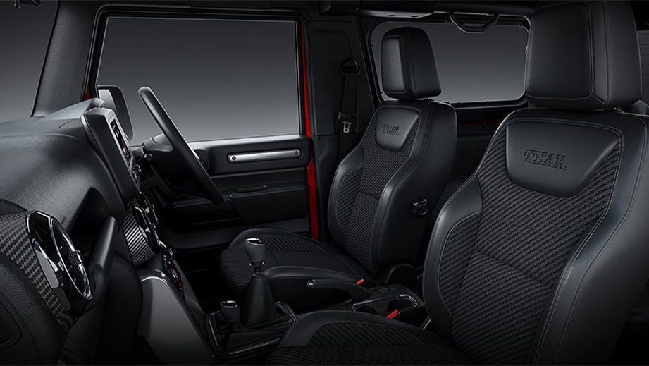 interior dashboard and front seats of a Mahindra Thar