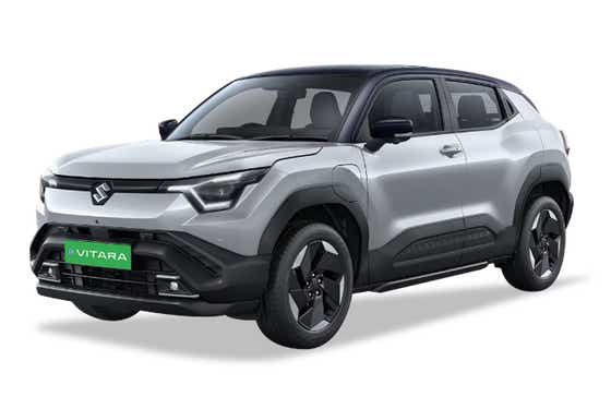 front three-quarter of a Splendid Silver with Bluish Black Roof Maruti Suzuki e Vitara