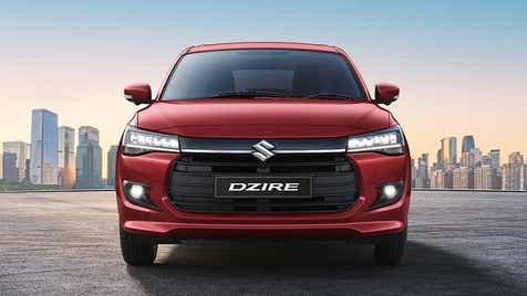 front view of a Gallant Red Maruti Suzuki Dzire