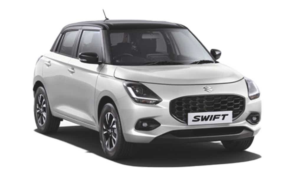 front three-quarter view of a Pearl Arctic White with Pearl Midnight Black Maruti Suzuki Swift