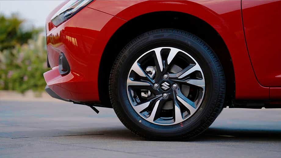 Front wheel and fender view of a Maruti Suzuki Swift