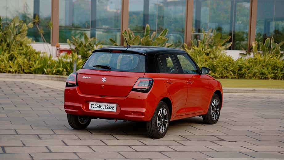 rear three-quarter view of a Maruti Suzuki Swift