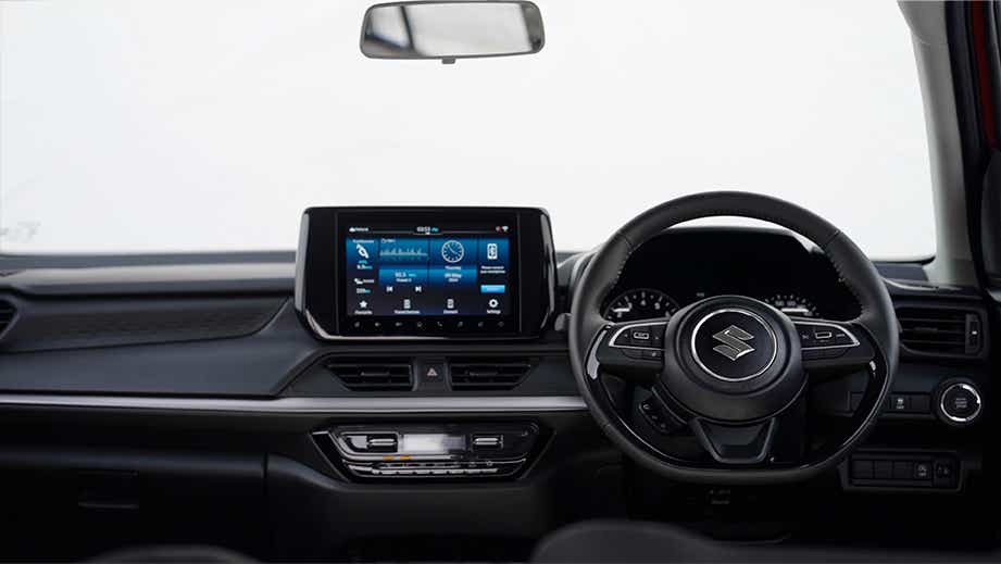 Dashboard and steering wheel of a Maruti Suzuki Swift