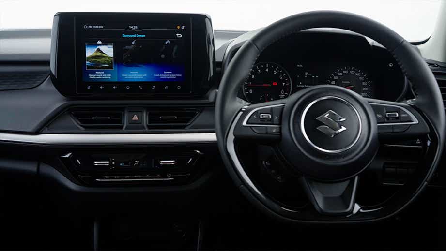 interior dashboard and steering wheel of a Maruti Suzuki Swift