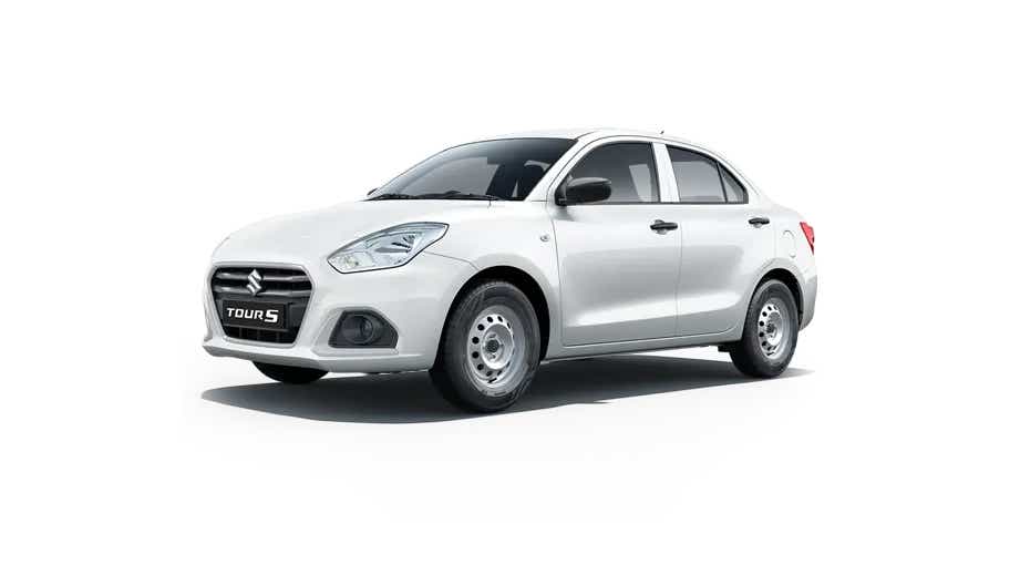 front three-quarter of a Pearl Metallic Arctic White Maruti Suzuki Dzire Tour