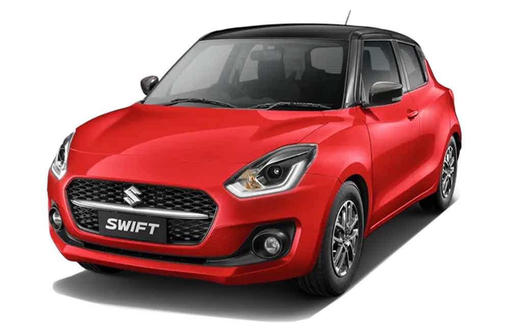 front three-quarter view of a Solid Fire Red with Pearl midnight black roof Maruti Suzuki Swift 2021 - 2023
