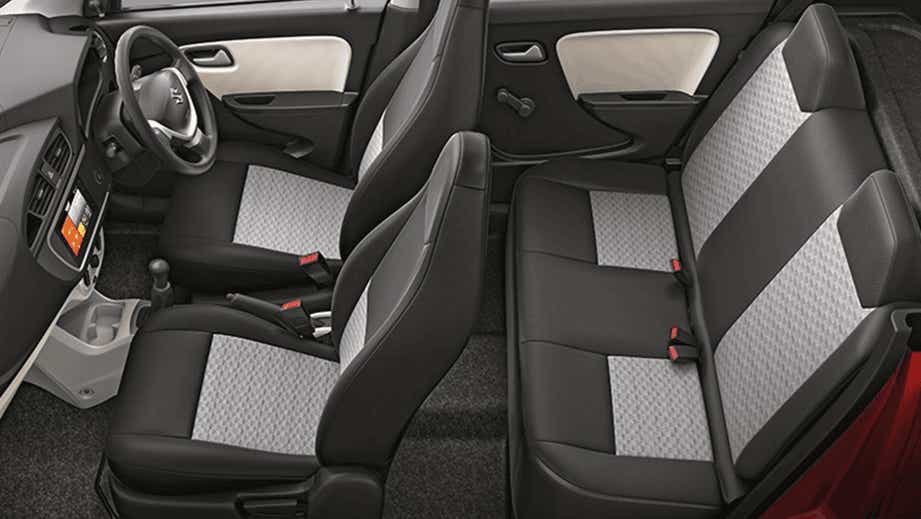 interior seats and dashboard of a Solid White Maruti Suzuki Alto Tour