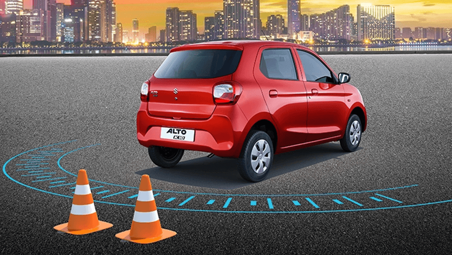 rear three-quarter of a Metallic Sizzling Red Maruti Suzuki Alto K10