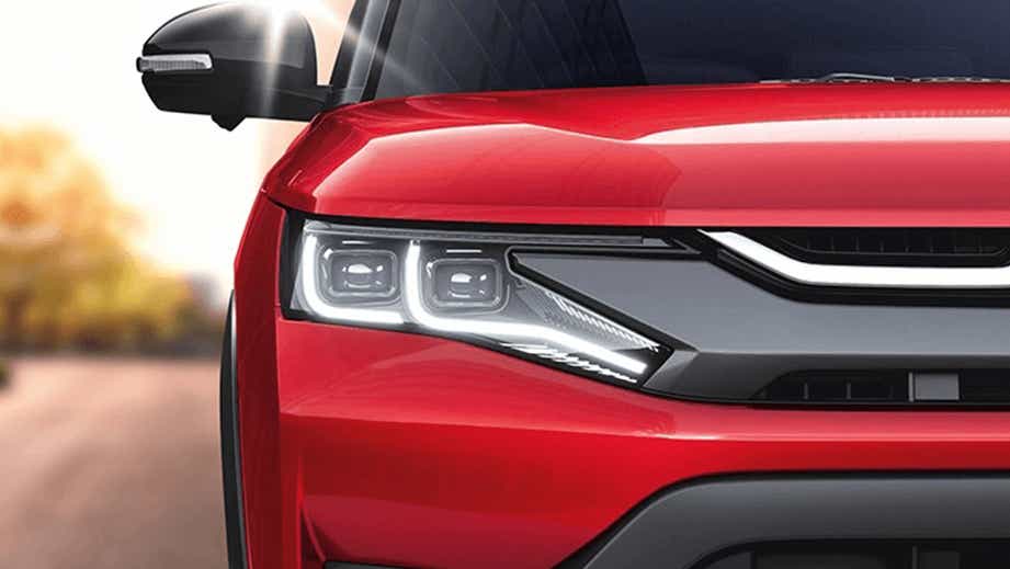 Front headlight close-up of a Maruti Suzuki Brezza