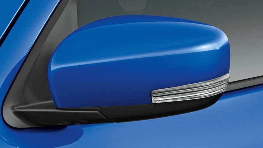 Side mirror close-up of a Speedy Blue Maruti Suzuki Celerio