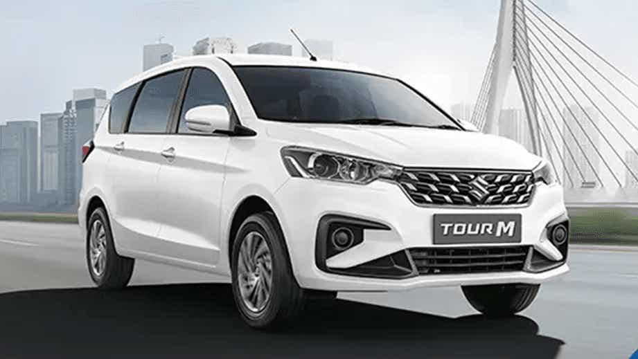 front three-quarter of a Pearl Arctic White Maruti Suzuki Ertiga Tour