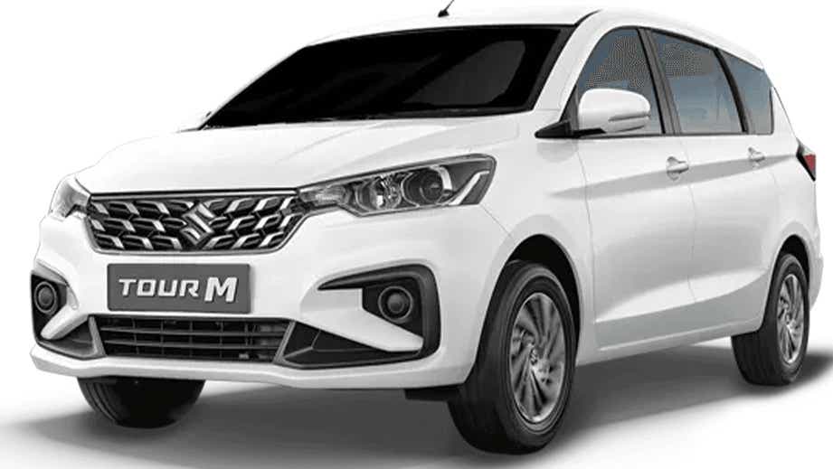 front three-quarter of a Pearl Arctic White Maruti Suzuki Ertiga Tour