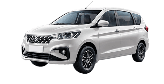 Front three-quarter view of a Pearl Arctic White Maruti Suzuki Ertiga Tour