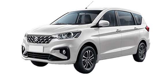 Front three-quarter view of a Pearl Arctic White Maruti Suzuki Ertiga Tour