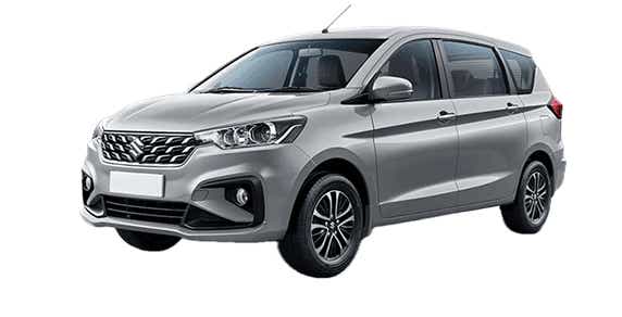 front three-quarter view of a Silky Silver Maruti Suzuki Ertiga Tour