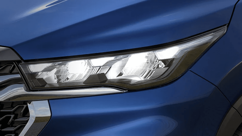 Headlight close-up of a Nexa Blue Maruti Suzuki Invicto