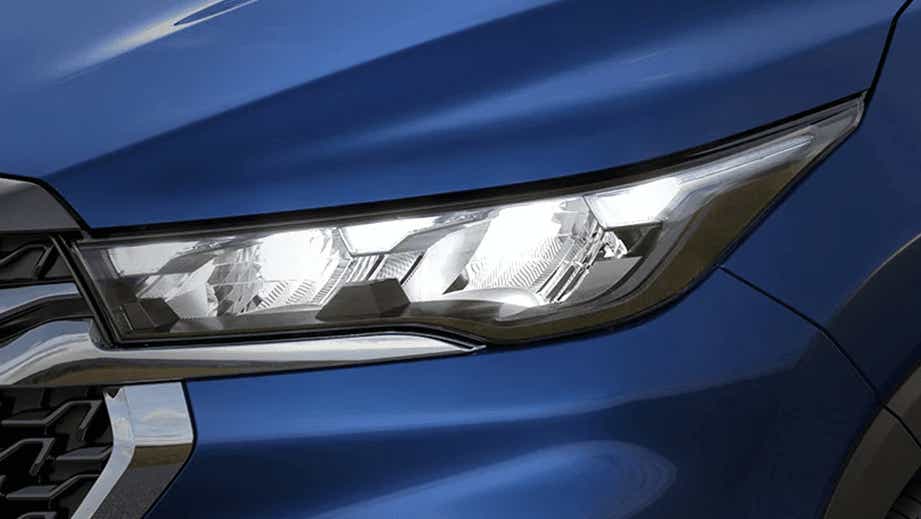 Headlight close-up of a Nexa Blue Maruti Suzuki Invicto