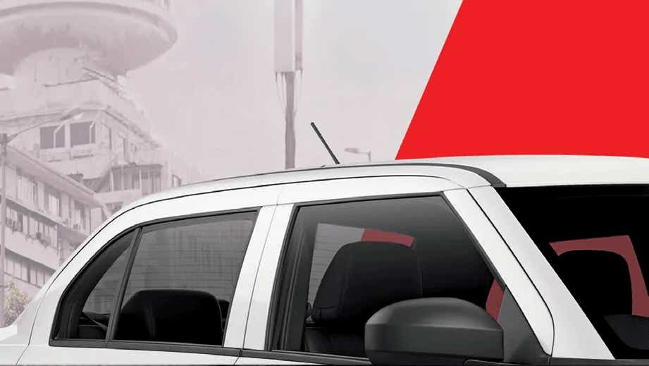 side profile of a Pearl Metallic Arctic White Maruti Suzuki Dzire Tour