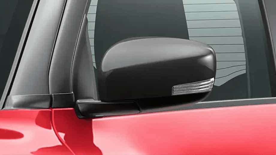 side mirror close-up of a Solid Fire Red with Pearl midnight black roof Maruti Suzuki Swift 2021 - 2023