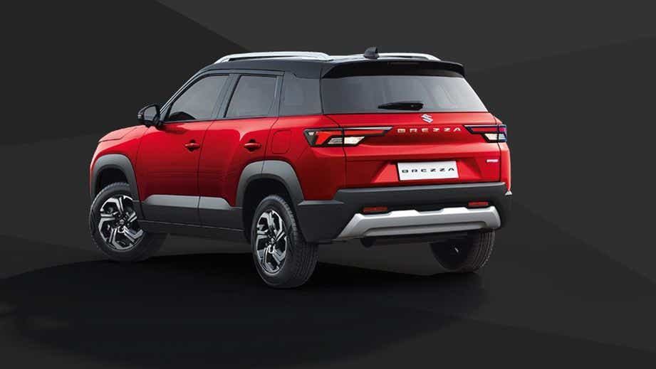 rear three-quarter of a Sizziling Red With Midnight Black Maruti Suzuki Brezza