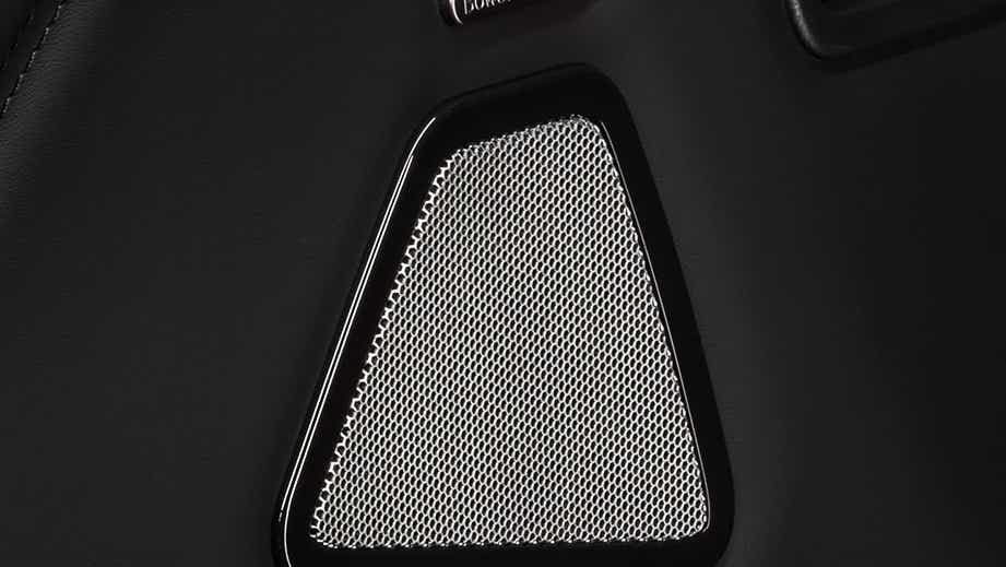 Close-up of door speaker grille in a Maserati Ghibli