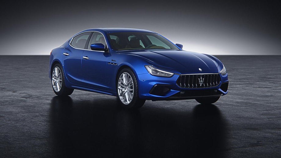 front three-quarter view of a Blue Maserati Ghibli