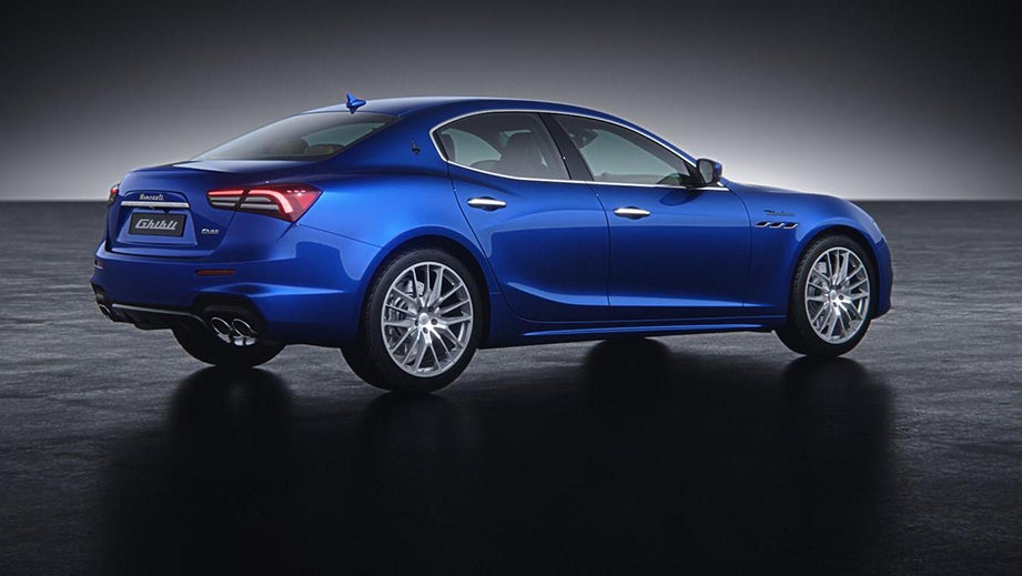 rear three-quarter view of a Blue Maserati Ghibli