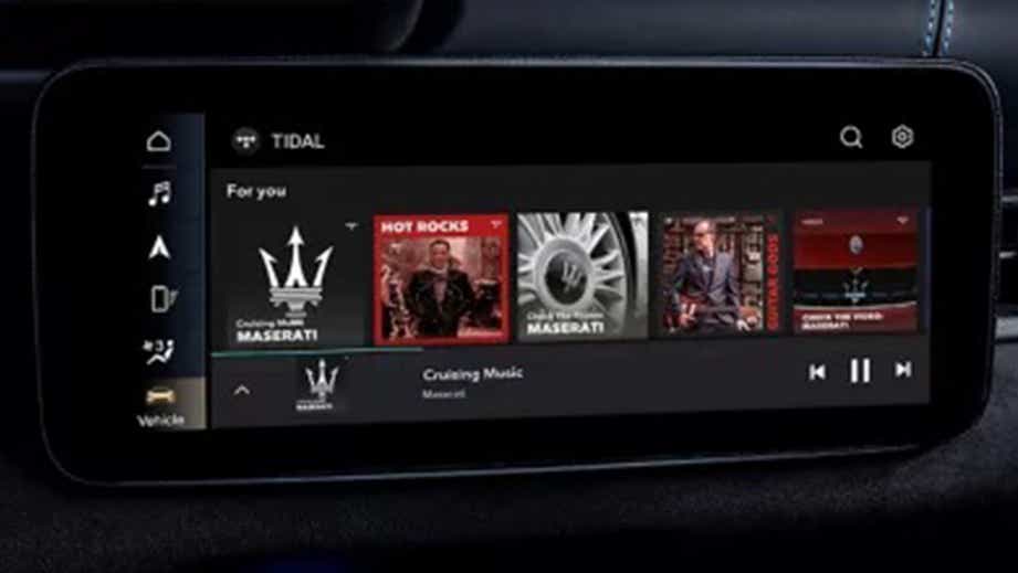 Infotainment display showing Tidal music streaming on a Maserati GranCabrio