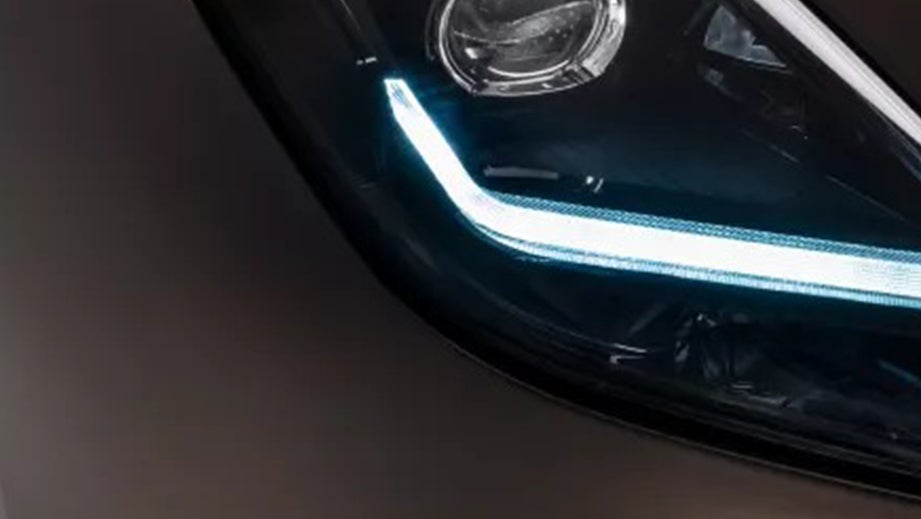 headlight close-up of a Maserati GranTurismo