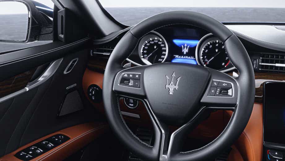 interior dashboard and steering wheel of a Maserati Quattroporte