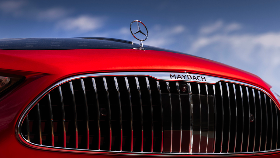 Front grille close-up of a Garnet Red Metallic Mercedes-Benz Maybach SL 680