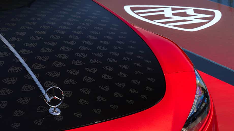 Front hood close-up of a Garnet Red Metallic Mercedes-Benz Maybach SL 680