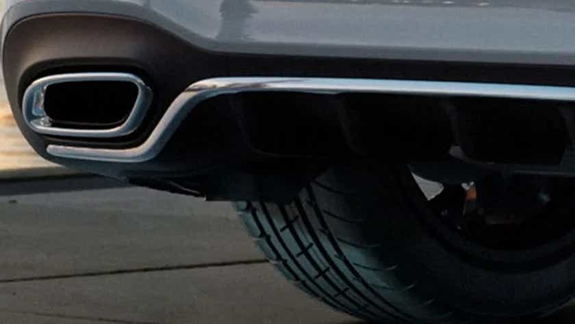 Rear bumper and exhaust close-up of a Polar White Mercedes-Benz A-Class Limousine