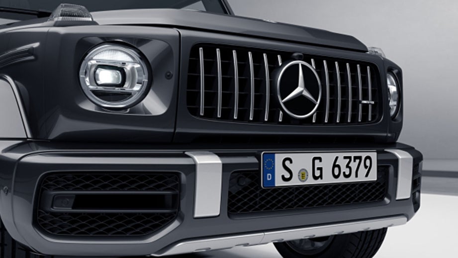 Front grille and headlight view of a Magnetic Black Metallic Mercedes-Benz AMG G 63