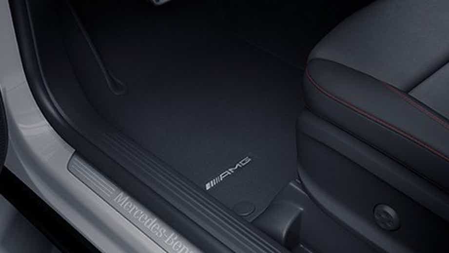 front seat and floor area of a Polar White Mercedes-Benz AMG GLA 35