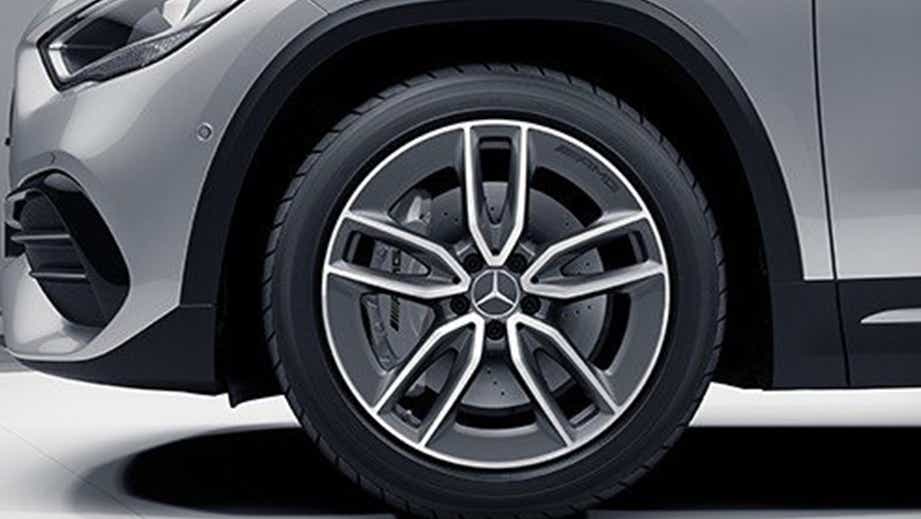 Front wheel close-up of a Polar White Mercedes-Benz AMG GLA 35