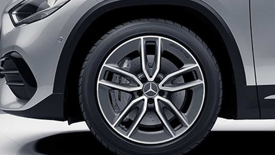 Front wheel close-up of a Polar White Mercedes-Benz AMG GLA 35