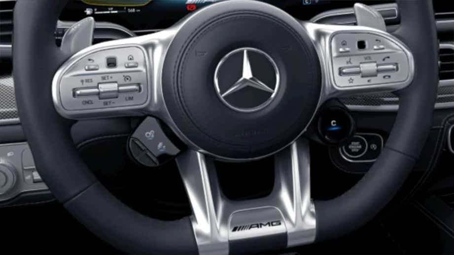 Steering wheel and dashboard of a Polar White Mercedes-Benz AMG GLE 63 S