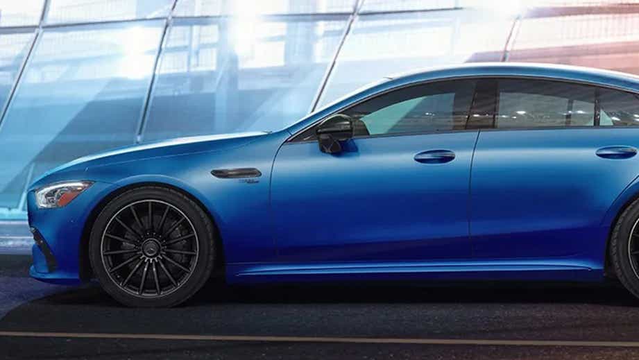 side view of a Starling Blue Metallic Mercedes-Benz AMG GT 4 Door Coupe