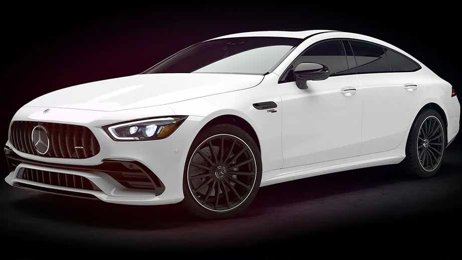 Front three-quarter of a Diamond White Metallic Mercedes-Benz AMG GT 4 Door Coupe