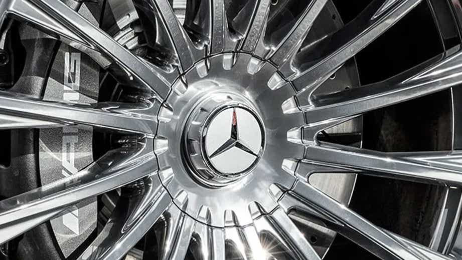 Close-up of wheel and brake of a Polar White Mercedes-Benz AMG S 63
