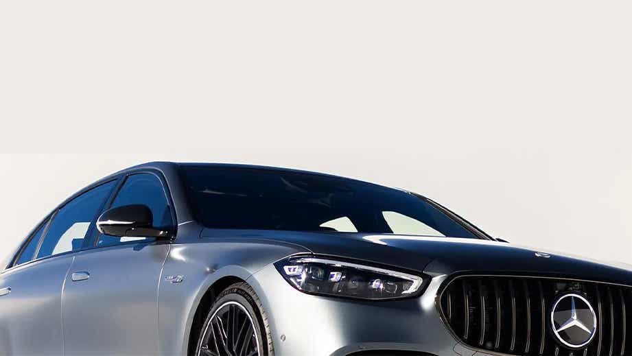 Front three-quarter view of a Polar White Mercedes-Benz AMG S 63