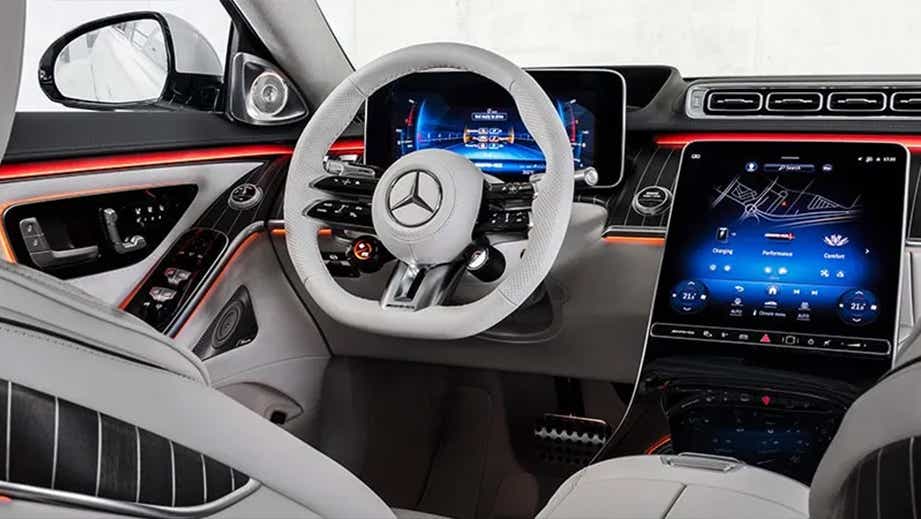 Interior dashboard view of a Polar White Mercedes-Benz AMG S 63