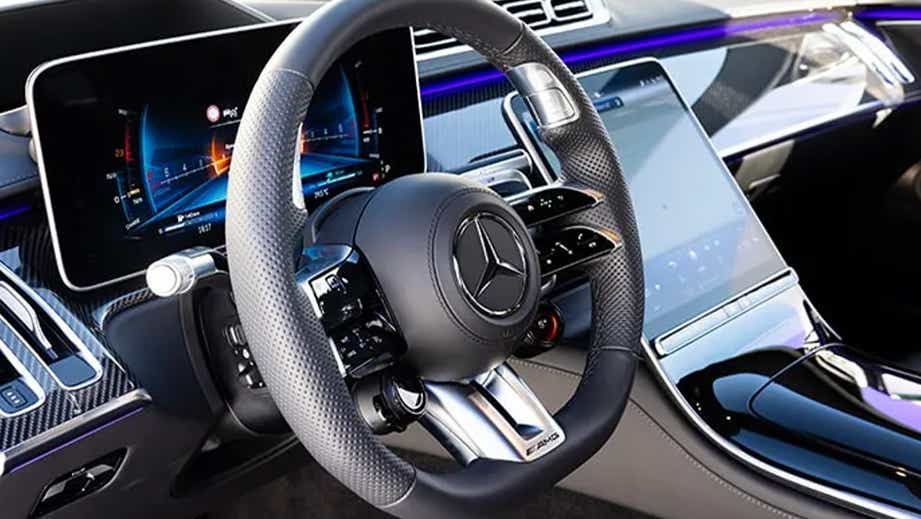 Interior dashboard view of a Polar White Mercedes-Benz AMG S 63