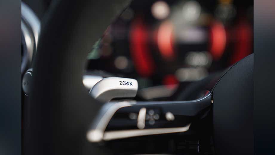 Steering wheel paddle shifter close-up of a Mercedes-Benz AMG SL