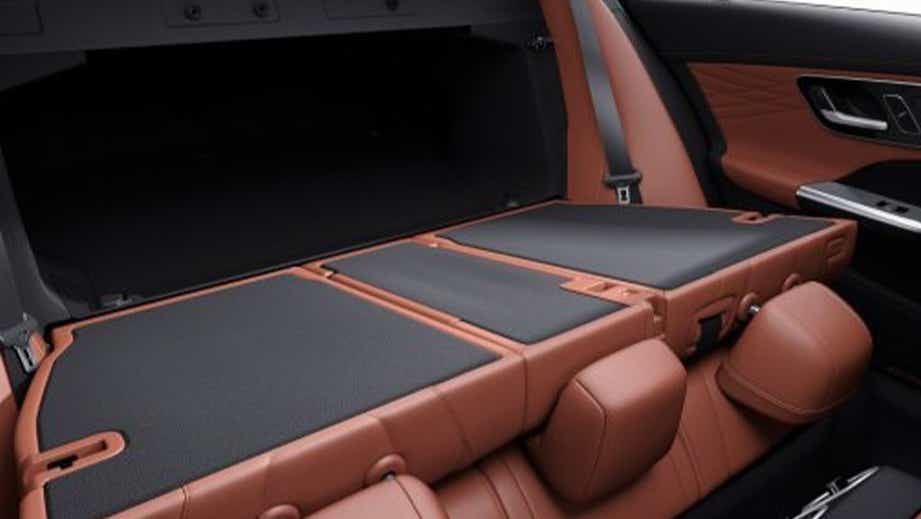 Rear seats folded flat in a Mercedes-Benz C-Class interior